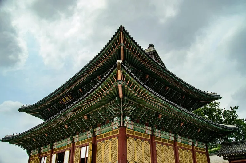 Traditional Korean palace architecture surrounded by nature
